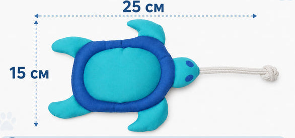 A blue and turquoise turtle-shaped dog toy with a white rope tail is shown on a light background with size annotations: 25 cm wide and 15 cm tall. Ukrainian text above describes size, and three small dog photos along the bottom indicate suitability for small, medium, and large breeds.
