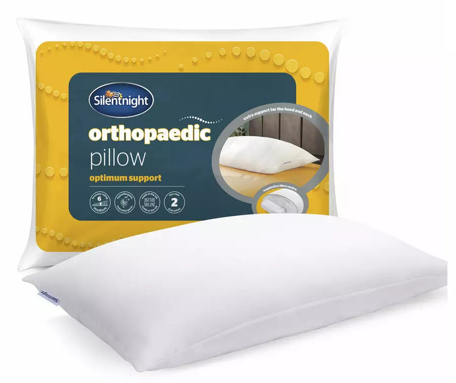 A white orthopaedic pillow shown in front of its retail packaging on a clean white background. The packaging features a yellow and dark blue label with the brand name 'Silentnight' and product type 'orthopaedic pillow'.
